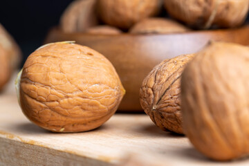 Unpeeled walnut harvest on the table