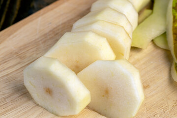 Fresh juicy pear cut into pieces and pieces