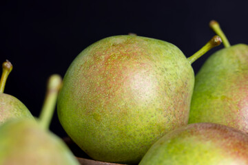 washed ripe green pears on the cutting board
