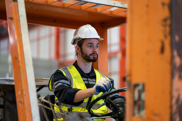 Male worker driving a forklift in factory © Duangporn