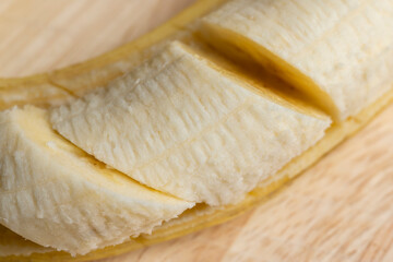 Peeled ripe yellow banana, close up