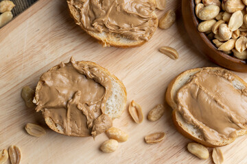 Fototapeta premium Peanut paste on a soft wheat baguette