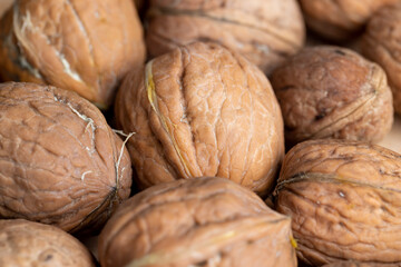 Unpeeled walnut harvest on the table