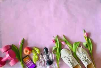 Tuinposter Getting fit, reducing weight and workout in the springtime and summer, flat lay with fitness items and tulip flowers © Kirsten Hinte