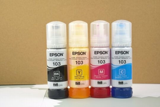 Four bottles of ink Epson, yellow, red, blue, black, built-in to the Epson L3150 series printer.