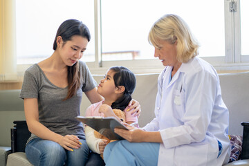 Pediatrician is closely caring and asking about sick girls symptoms, health concepts and child care.