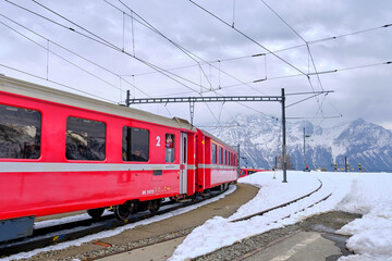Obraz premium The famous Swiss mountain train of Bernina Express crossed italian and swiss Alps