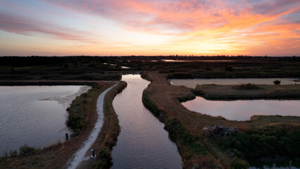 pink sunrise over the salt tides of the island of oleron