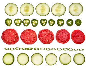 Pattern of sliced vegetables on a white background. Food ingredients. Tomatos, cucumbers, jalapenos, green onion, zucchini. No background.