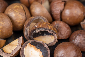 Unpeeled macadamia nuts on the table