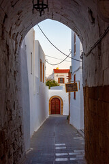 Sunset view of white streets of Greek town Lindos at Rhodes island