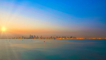 View of the Kuwait skyline - with the best known landmark of Kuwait City - during sunrise..