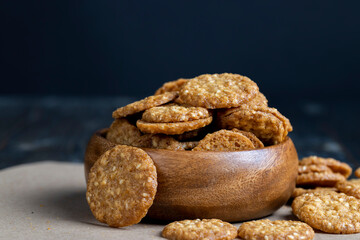 oatmeal thin round cookies with lots of sesame seeds
