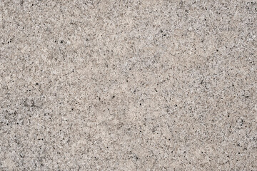 Beautiful abstract background from beige marble with dark spots.
