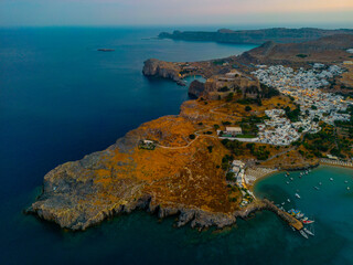 Sunset view of Saint Paul's beach and Acropolis at Greek town Lindos at Rhodes island