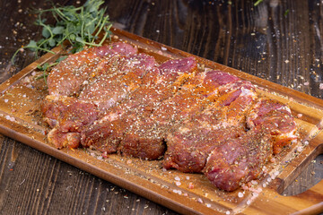 Pork meat pieces marinated with spices and salt