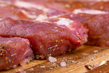Pork meat pieces marinated with spices and salt