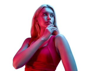 Muscular attractive femaile model posing in studio. Neon glow studio light, vibrant red and blue colored portrait. Her hand at her lips.