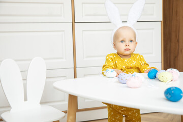 Newborn baby girl in a rabbit ears. Easter Holiday