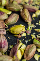 Crispy delicious pistachios with salt on the table