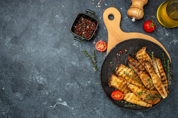 king oyster mushrooms, Pleurotus eryngii grilled with spices and herbs. Healthy vegan food concept,...