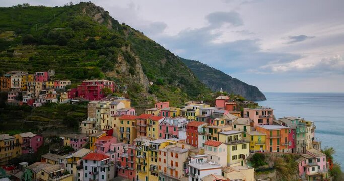 Village of Manarola Cinque Terre Italy Liguria famous historic town of colorful houses on the cliffs of Mediterranean Sea Drone view