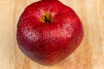 Red peel of a ripe and juicy apple