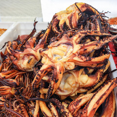 Octopus tentacles are sold at the outdoor market