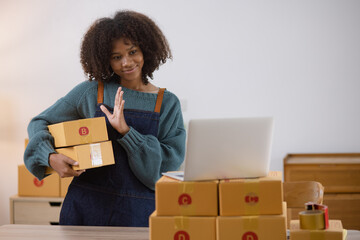 Young African American woman and online selling at home office, Startup small business owner working Online selling and product order for delivery to customer.