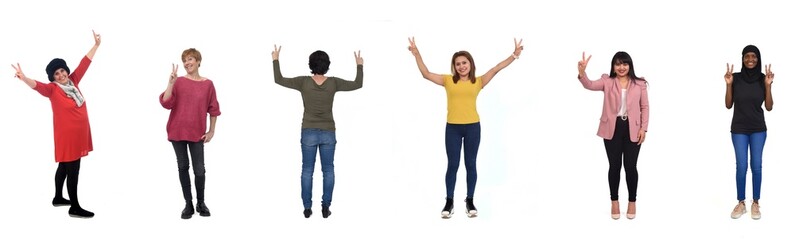 group of women showing v sign on white background © Curto