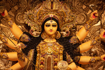 Idol of Goddess Devi Durga at a decorated puja pandal in Kolkata, West Bengal, India. Durga Puja is...