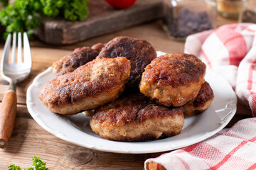Minced Cutlets with Vegetables on a table. Horizontal