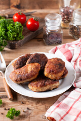 Pork cutlets from minced meat. Pan-fried meatballs. Healthy dinner for the family.