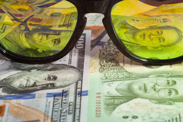 Sunglasses reflecting money.