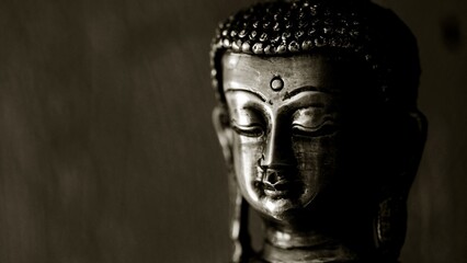 Fototapeta na wymiar Traditional bronze Buddha statue isolated on black background.
