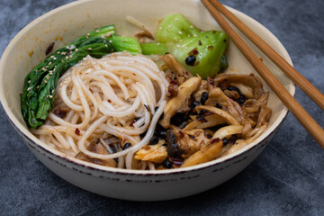 Mushroom, black fermented soy beans  amd starch noodles stir fry with bok chou,  bowl , chopsticks