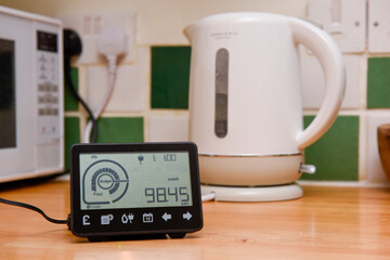 Smart energy meter in a home interior to monitor electricity usage in the house and reduce cost of living price