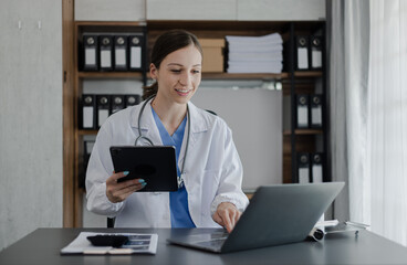 Fototapeta premium Medicine doctor touching on digital tablet and hologram modern virtual screen interface icons, Medical technology and futuristic concept.