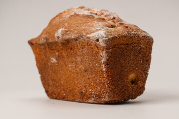 A cupcake with raisins isoalted on a white background.
