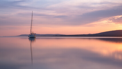 a boat at sunset at lake Balaton