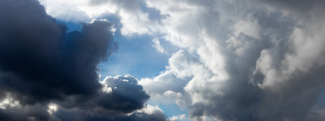 Stormy sky with dark and white  large clouds