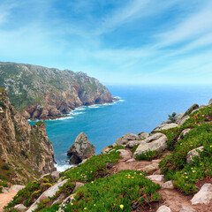 Fototapeta na wymiar Atlantic ocean coast in cloudy weather. View from Cape Roca (Cabo da Roca), Portugal.