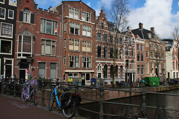bridge (grimburgwal), canal and houses in amsterdam (netherlands)