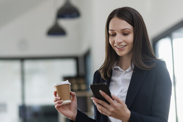 Young business woman using smartphone in the office, Business person and technology, Female using mobile phone, 