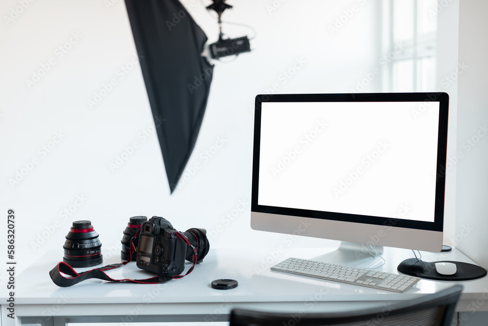 Aufkleber workplace of photographer with empty computer screen and camera accessories, photostudio with lighti
