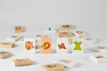 word hoax, which is formed from colorful letters printed on wooden blocks for children's games, can be used as a concept