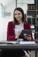 Happy excited young successful business woman and working online at the table in office, Businesswoman and finance marketing.