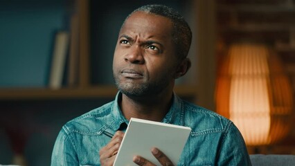 Mature pensive african american man indoors writing notes creative thoughts in notebook thoughtful businessman thinking write startup business idea plan making note in diary create to-do or wish list
