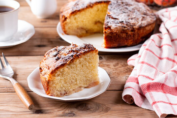 Clasic sponge cake, selective focus. Homemade pie on rustic wooden table