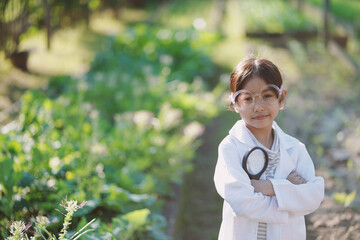 A girl is studying and learning to grow vegetables.Smart Farming, the new innovation of farming, cultivating, growing vegetables.